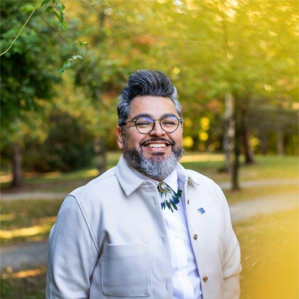 Tiburcio Lince, director of Grand Valley's Office of Multicultural Affairs, poses outside for a photo.